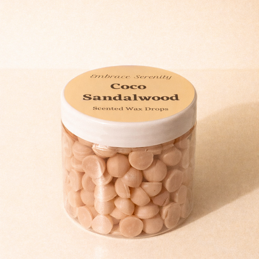 Jar of Coco Sandalwood scented wax drops on a beige background